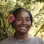 Yudris, a member of our local guide team, smiling with a pink hibiscus flower in her hair